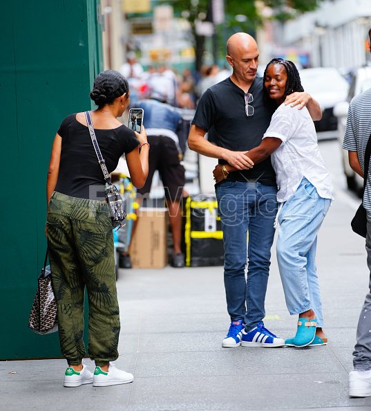 Yara Shahidi takes a photo of her father Afshin Shahidi and mother