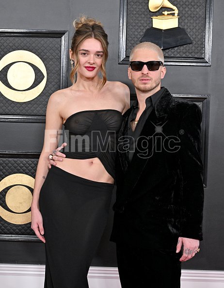 Charlotte Lawrence and Andrew Watt attend the 65th GRAMMY Awards at