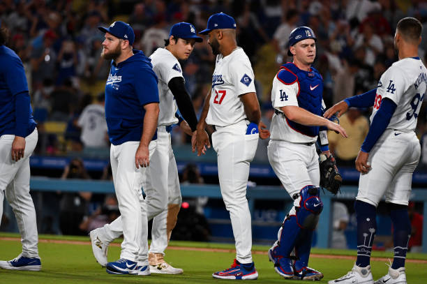 Los Angeles Dodgers players celebrate after winning the regular season game against the Philadelphia Phillies at Dodger Stadium on August 05, 2024 in...