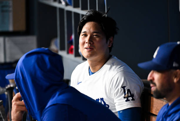 Shohei Ohtani of Los Angeles Dodgers looks on in the top of the ninth inning during the regular season game against the Philadelphia Phillies at...