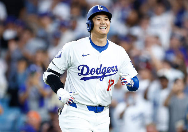 Shohei Ohtani of the Los Angeles Dodgers hits a two-run home run against the Pittsburgh Pirates in the third inning at Dodger Stadium on August 09,...