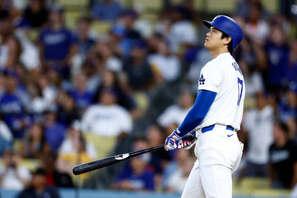Shohei Ohtani of the Los Angeles Dodgers hits a two-run home run against the Pittsburgh Pirates in the third inning at Dodger Stadium on August 09,...