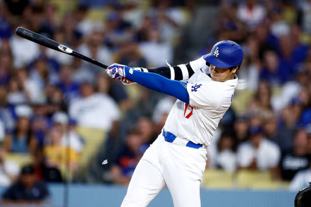 Shohei Ohtani of the Los Angeles Dodgers hits a two-run home run against the Pittsburgh Pirates in the third inning at Dodger Stadium on August 09,...