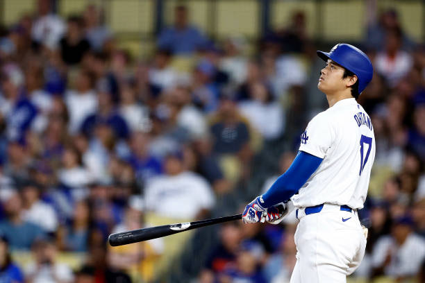 Shohei Ohtani of the Los Angeles Dodgers hits a two-run home run against the Pittsburgh Pirates in the third inning at Dodger Stadium on August 09,...