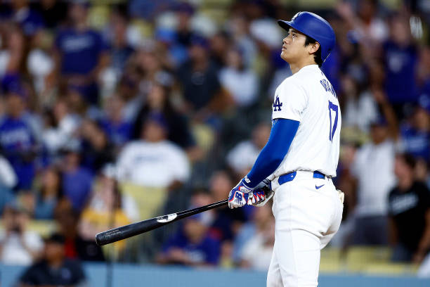 Shohei Ohtani of the Los Angeles Dodgers hits a two-run home run against the Pittsburgh Pirates in the third inning at Dodger Stadium on August 09,...