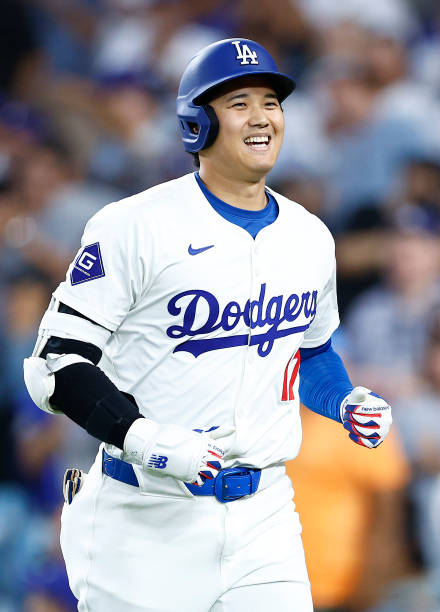 Shohei Ohtani of the Los Angeles Dodgers hits a two-run home run against the Pittsburgh Pirates in the third inning at Dodger Stadium on August 09,...