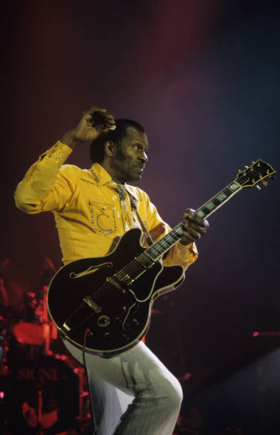 American singer and guitarist Chuck Berry performs on stage in 1994.