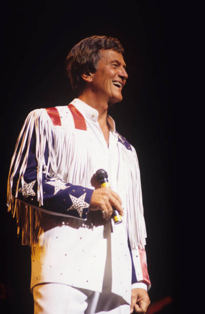 American singer Pat Boone performs on stage in 1995.