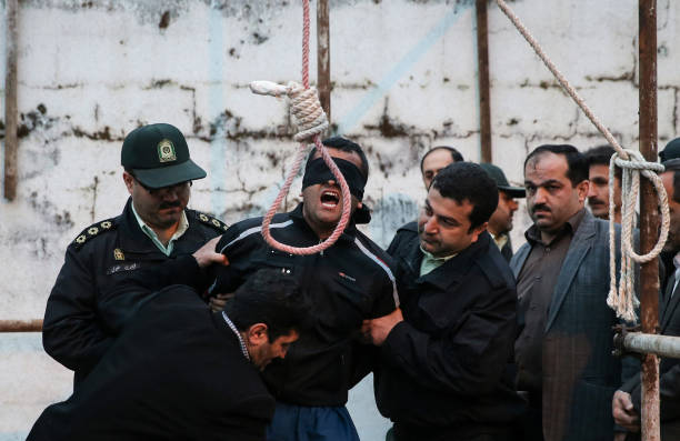 Balal who killed Iranian youth Abdolah Hosseinzadeh in a street fight with a knife in 2007 is brought to the gallows during his execution ceremony in...