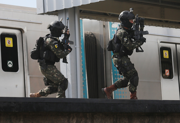 Brazilian soldiers conduct a counterterrorism drill simulating an ...