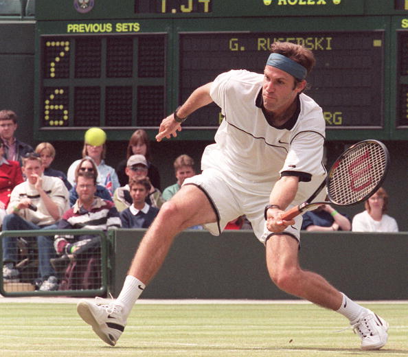 briton-greg-rusedski-moves-forward-to-return-a-ball-from-us-richey-picture-id51658068