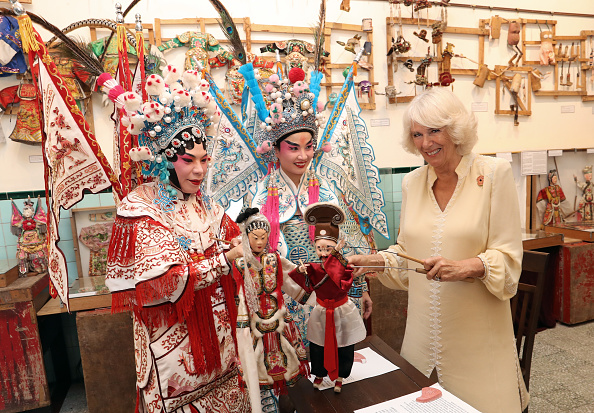 camilla-duchess-of-cornwall-takes-part-in-a-traditional-puppet-show-picture-id871095218