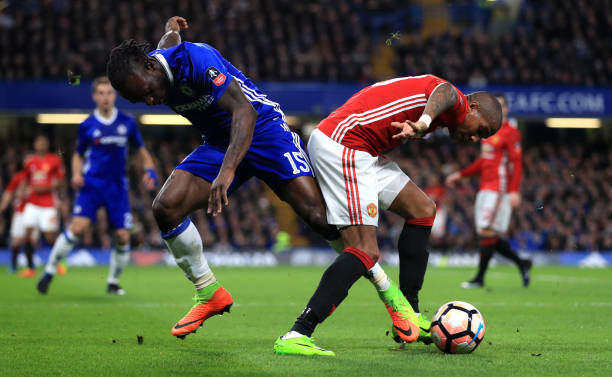 Chelsea's Victor Moses and Manchester United's Ashley Young (right) during the Emirates FA Cup, Quarter Final match at Stamford Bridge, London.