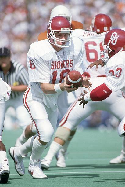 Oklahoma QB Troy Aikman (18) in action, handoff vs Texas. Dallas, TX