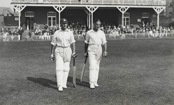 Cricket. Circa 1930+s. A picture of the legendary England batting pair of JB (John 'Jack' Berry) Hobbs (Surrey) and Herbert Sutcliffe (Yorkshire) walking out to bat at the Scarborough Cricket Festival. : News Photo