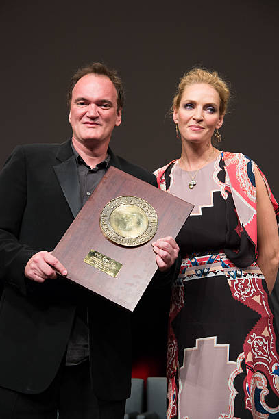 US Director Quentin Tarantino poses next to actress Uma Thurman after receiving the Lumiere Award, during the 5th Lumiere Film Festival, in Lyon.