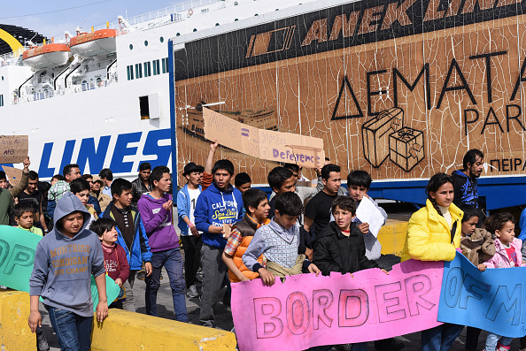 Afghani demonstrating against closed borders in Piraeus