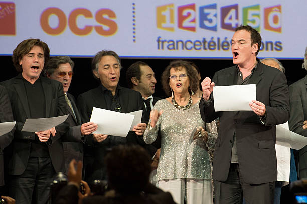 Jean Michel Jarre, Daniel Auteuil, Richard Berry, Patrick Timsit, Claudia Cardinale and Quentin Tarantino on stage during the Tribute to Jean Paul Belmondo and Opening Ceremony of the Fifth Lumiere Film Festival, in Lyon.