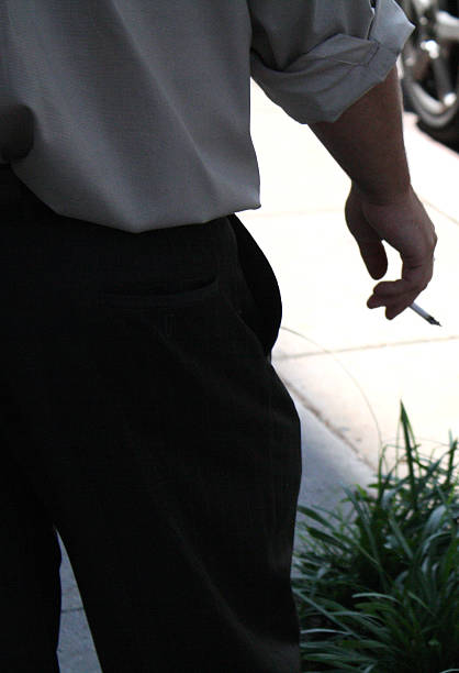 A man smokes a cigarette in Washington DC on June 2, 2010.