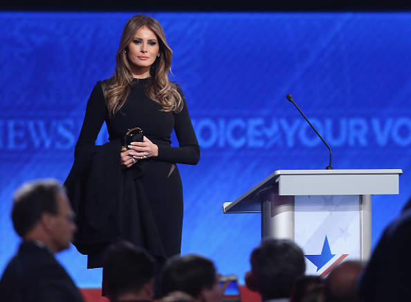 Melania Trump wife of Republican presidential candidate Donald Trump stands on stage following the Republican presidential debate at St Anselm...