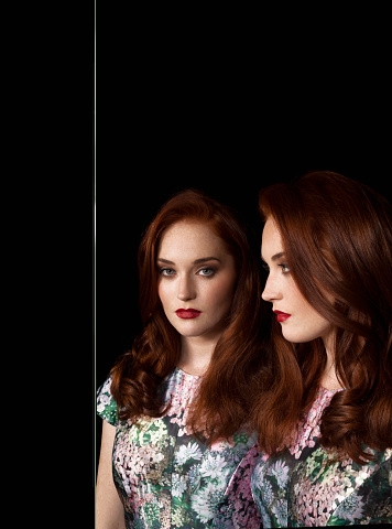 Mirror reflection image of female with long hair : Stock Photo