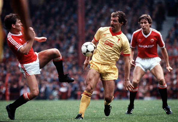 Old Trafford, Manchester. Manchester United v Liverpool. Liverpool's Graeme Souness is challenged by Manchester United's Bryan Robson, as Arnold Muhren looks on. : News Photo