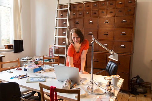 Portrait of female designer in home office. : Stock Photo