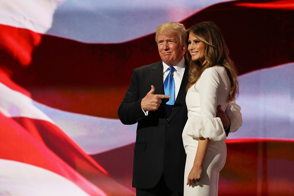 Presumptive Republican presidential nominee Donald Trump gestures to his wife Melania after she delivered a speech on the first day of the Republican...