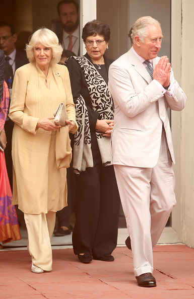 prince-charles-prince-of-wales-performs-the-namaste-gesture-as-he-and-picture-id871551428
