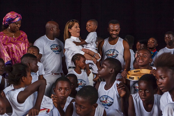 princess-caroline-of-hanover-holds-a-child-in-kinshasa-on-september-picture-id610528150