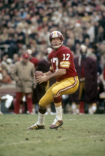 quarterback-billy-kilmer-of-the-washington-redskins-drops-back-to-picture-id106826780