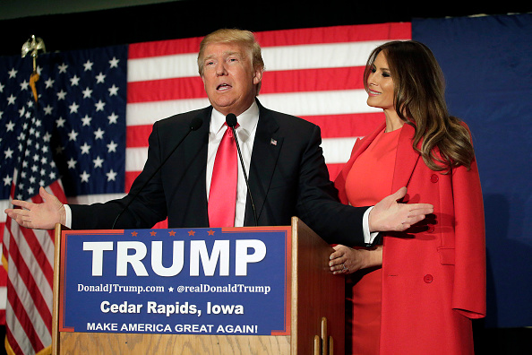 Republican presidential candidate Donald Trump speaks with his wife Melania Trump by his side during a campaign event at the US Cellular Convention...