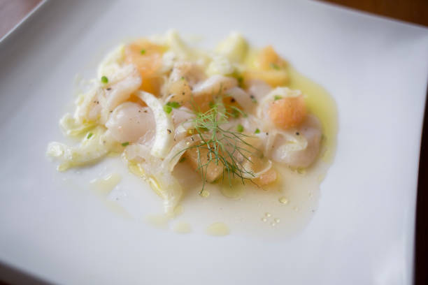 Scallop crudo with grapefruit, fennel and chili.