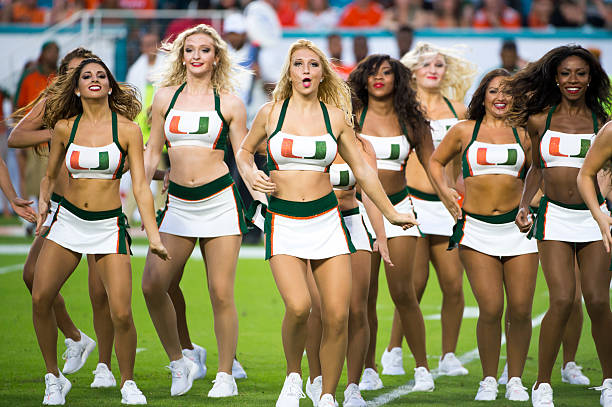 University of Miami cheerleader performs on the field 