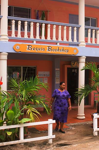 The Grenadines, Bequia Island, Port Elizabeth, Bookshop, Woman.