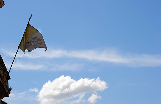 The Vatican flag blows in a gust of wind at the Vatican on May 21, 2010.