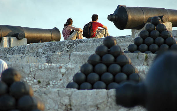 Tourists sunbath at Morro Castle, on August 26, 2010 in Havana.
