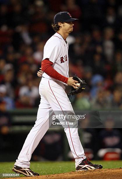 Clay Buchholz of the Boston Red Sox reacts before he is pulled from the game in the top of the ninth inning against the Minnesota Twins on May 19,...