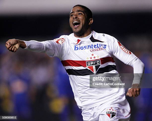 Junior Cesar of Sao Paulo celebrates a scored goal against Cruzeiro during a match as part of the Libertadores Cup 2010 on May 19, 2010 in Sao Paulo,...