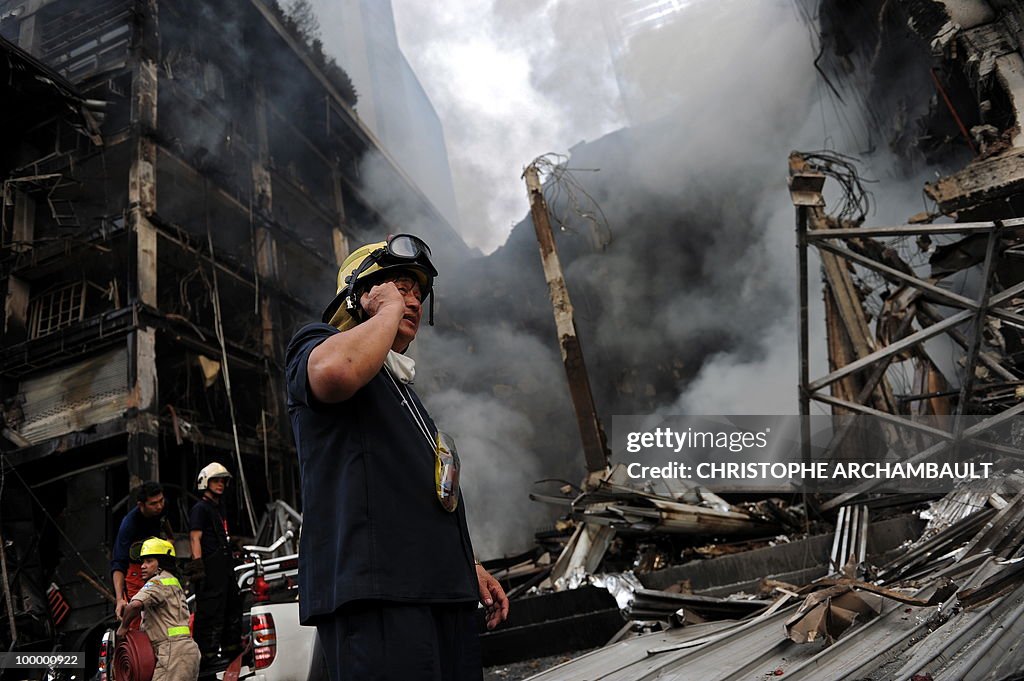A fireman talks on his mobile phone as h