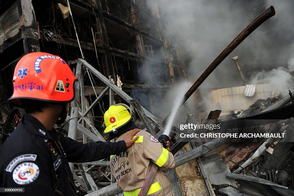 Thai firemen fight the fire at Thailand'