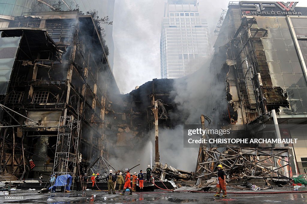 Thai firemen try to put douse the flames