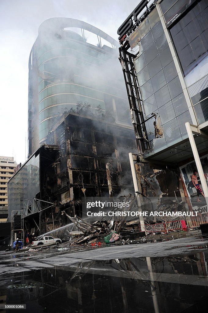 Thai firemen try to douse the flames at