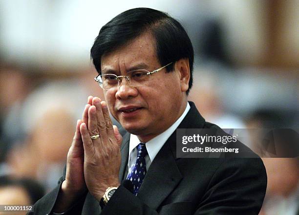 Bouasone Bouphavanh, Lao's prime minister, makes a greeting as he arrives for the 16th International Conference on The Future of Asia in Tokyo,...