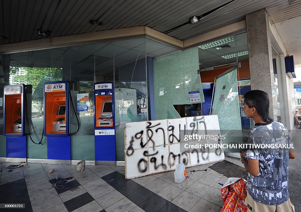 A Thai man looks at damage of Bangkok Ba