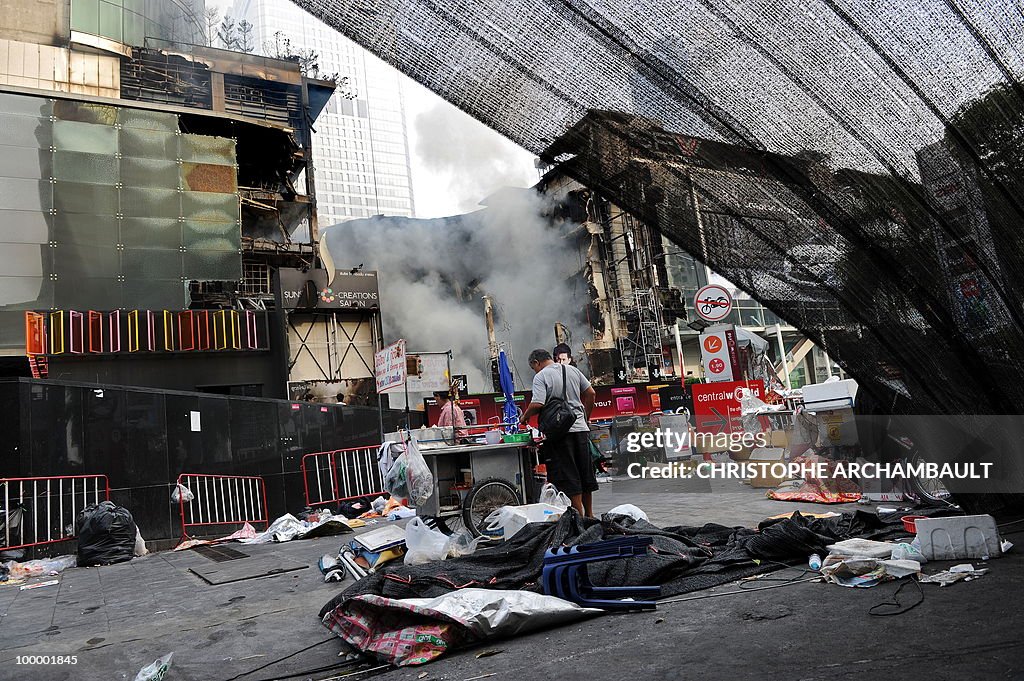 People walk through a dismantled anti-go