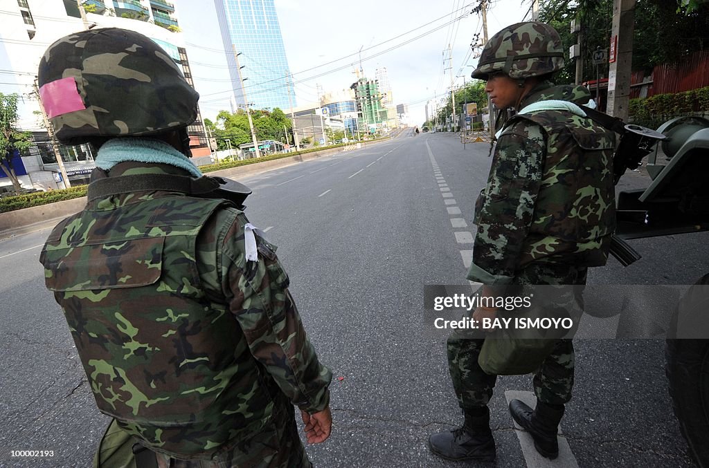 Soldiers stand guard on Rama IV boulevar