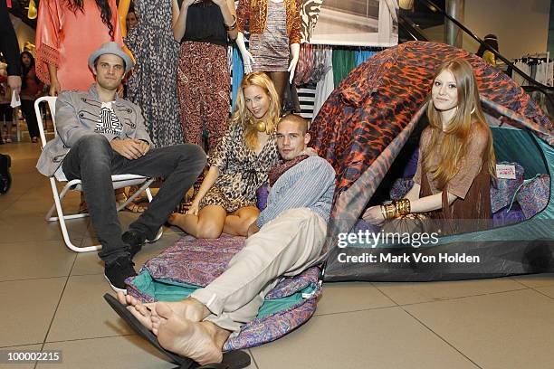 Models pose at the H&M's launch of Fashion Against AIDS at H&M Fifth Avenue on May 19, 2010 in New York City.