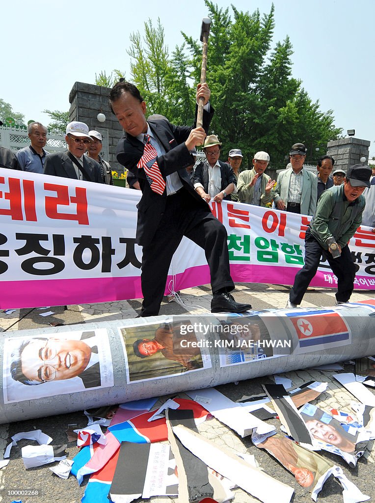 South Korean activists smash a mock Nort