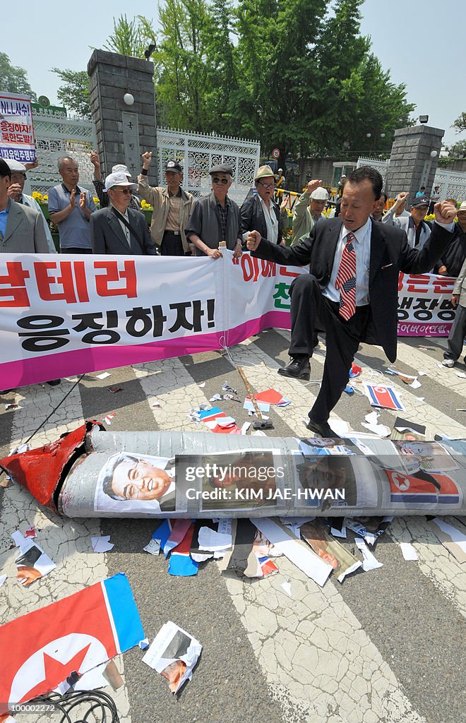 South Korean activists smash a mock Nort